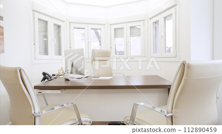 Interior of spacious doctor clinic with chairs at computer desk 112890459