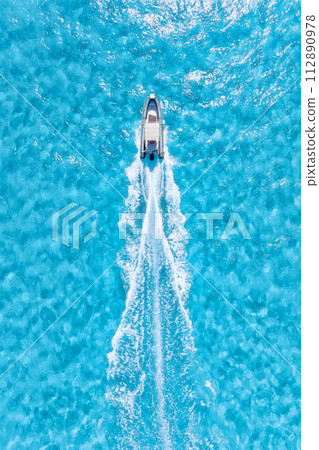 Aerial view on fast boat on blue sea at sunny day. Vacation and leisure. 112890978
