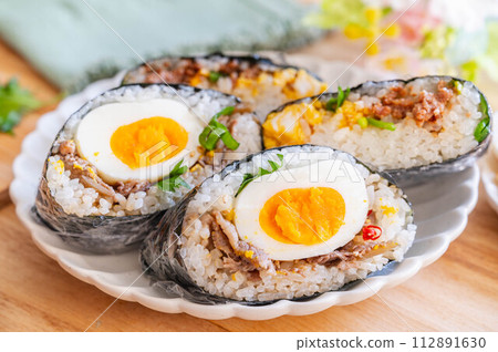 Two types of onigirizu with egg as an ingredient Two types of onigirizu with egg as an ingredient 112891630