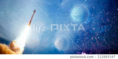 rockets launch into space on the starry sky. spacecraft flies into space with clouds of smoke. Elements of this image furnished by NASA rockets launch into space on the starry sky. spacecraft flies into space with clouds of smoke. Elements of this image furnished by NASA 112893147