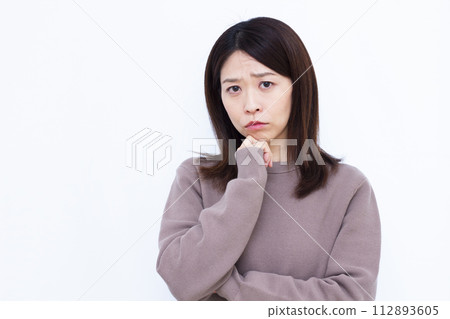 A woman who is seriously worried A woman who is seriously worried 112893605