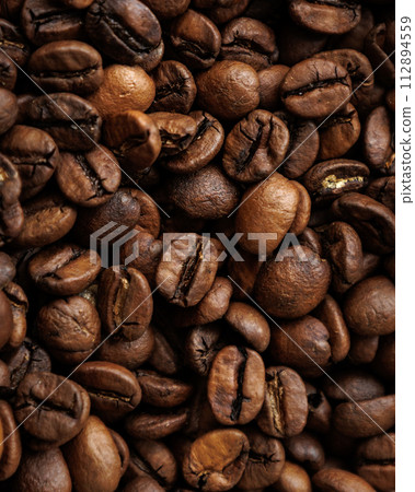 coffee beans are on table after roasting. 112894559