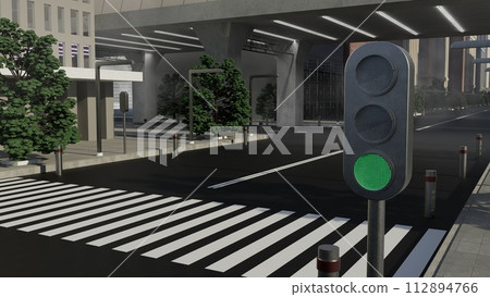A green traffic light is lit up on a street 112894766