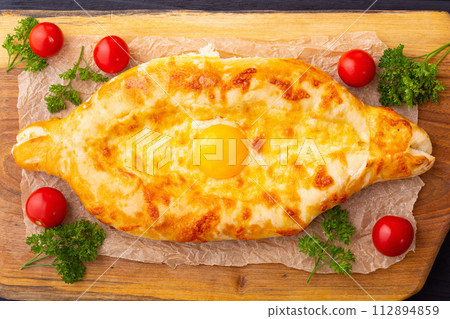 Homemade adjarian khachapuri with egg 112894859