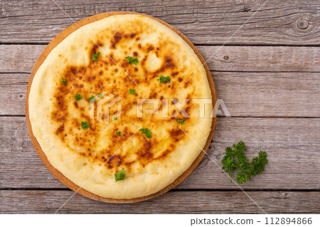 Homemade khachapuri bread with cheese Homemade khachapuri bread with cheese 112894866