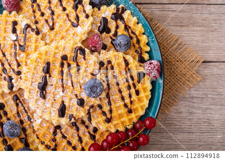 Sweet golden Belgian waffles 112894918