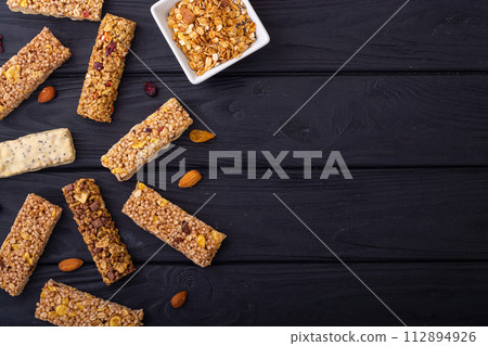 Healthy cereal bar from granola and dried berries Healthy cereal bar from granola and dried berries 112894926