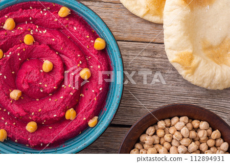 Declicious food from chickpea - beetroot hummus 112894931