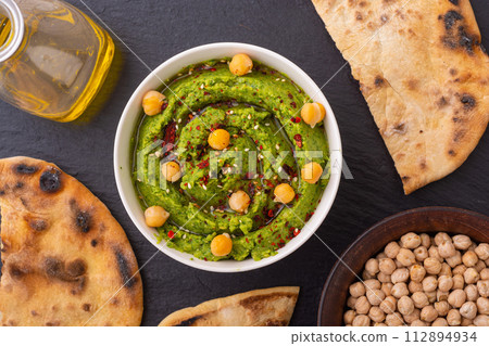 Declicious food from chickpea - green hummus 112894934