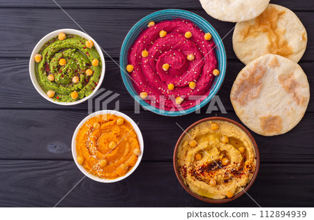 Declicious food from chickpea - mix of hummus Declicious food from chickpea - mix of hummus 112894939