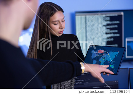 Cyber security team working in a Cyber Security Operations Center SOC to protect systems and technologies 112896194