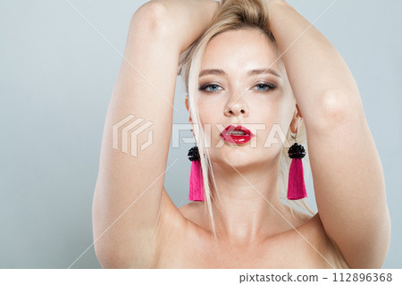 Beautiful blonde person portrait. Beauty woman with clear shiny fresh skin and blond hair  112896368