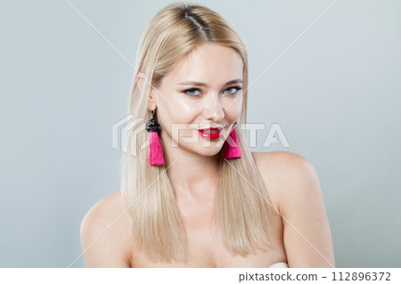 Smiling blonde person portrait. Beauty woman with clear shiny fresh skin and blond hair Smiling blonde person portrait. Beauty woman with clear shiny fresh skin and blond hair 112896372