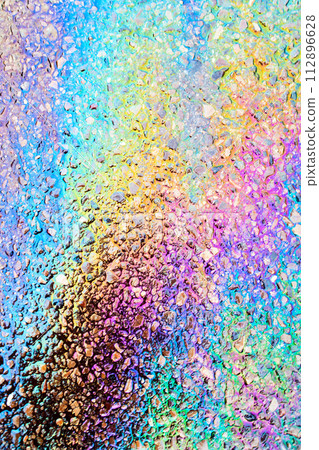 Leaked Gasoline Oil Slick or Petrol Rainbow Enviromental leak On Tarmac Road 112896628