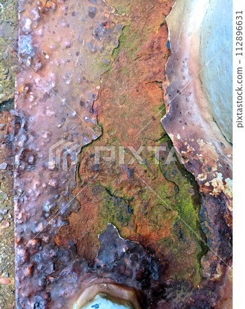 Close Up of a Rusted Iron Metal Industrial Floor with a Bolt in An Abandoned Area Close Up of a Rusted Iron Metal Industrial Floor with a Bolt in An Abandoned Area 112896631