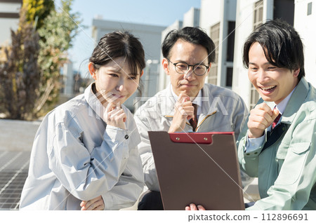 young male and female engineers young male and female engineers 112896691