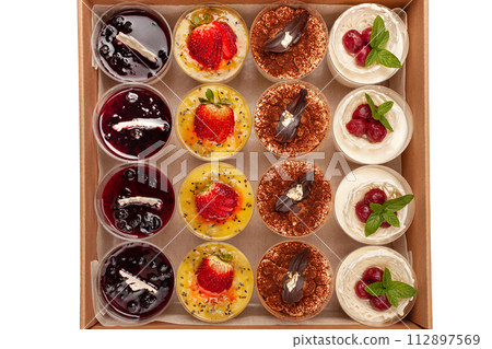 Food delivery box for Dinner. Food delivery from markets and restaurants. Meal for a week on quarantine. Fresh Desserts tiramisu, souffle jelly at the craft box. Contactless food delivery Food delivery box for Dinner. Food delivery from markets and restaurants. Meal for a week on quarantine. Fresh Desserts tiramisu, souffle jelly at the craft box. Contactless food delivery 112897569