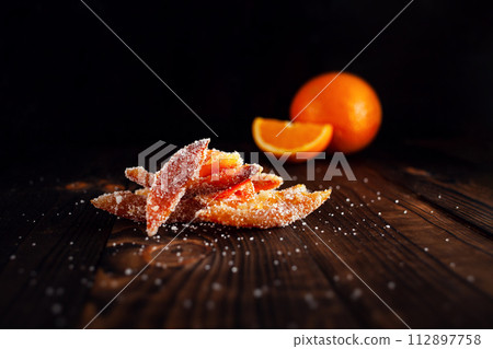 Orange peels in sugar. Candied fruit from orange Orange peels in sugar. Candied fruit from orange 112897758