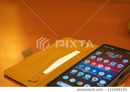 smartphone on the desk smartphone on the desk 112898143