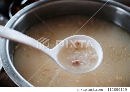 Chinese Ladle or dipper in rice porridge with pork pot homemade breakfast in Thailand 112899119