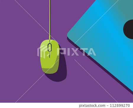 A green computer mouse sits on a desk. A green computer mouse sits on a desk. 112899270