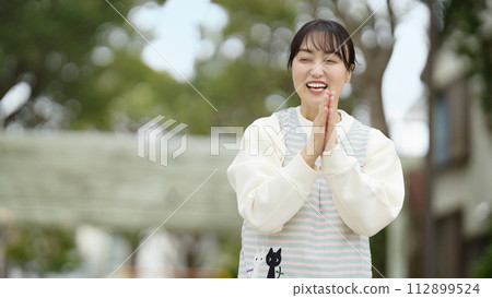 Nursery teacher watching over children in the park Nursery teacher watching over children in the park 112899524