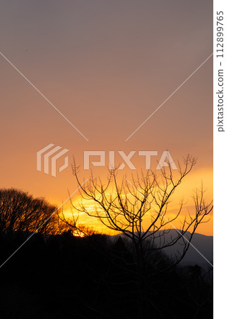 sunset over the mountains 112899765