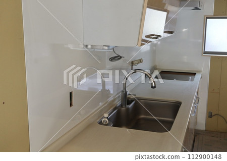 System kitchen installed in a home being renovated 112900148