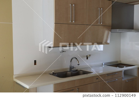 System kitchen installed in a home being renovated System kitchen installed in a home being renovated 112900149