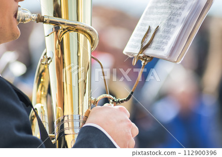 Details of hands playing tuba bass Details of hands playing tuba bass 112900396