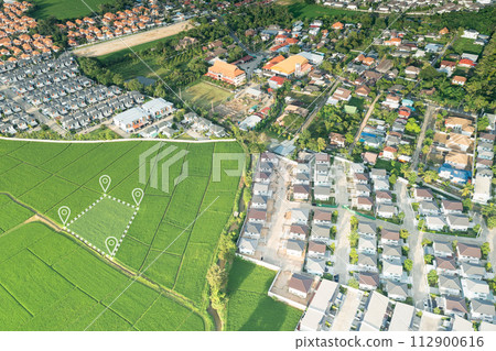 Land plot and house in aerial view. Land plot and house in aerial view. 112900616