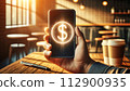 A hand holds a mobile phone with a simple 3D dollar coin hologram floating outside 112900935