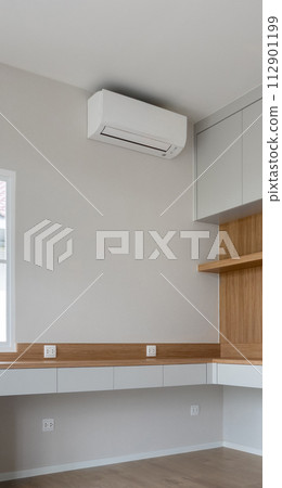 Air conditioner on white wall room interior background Air conditioner on white wall room interior background 112901199