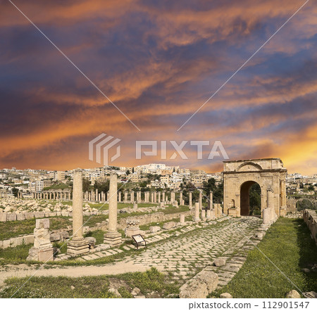 Roman ruins (against the background of a beautiful sky with clouds) in the Jordanian city of Jerash (Gerasa of Antiquity), capital and largest city of Jerash Governorate, Jordan Roman ruins (against the background of a beautiful sky with clouds) in the Jordanian city of Jerash (Gerasa of Antiquity), capital and largest city of Jerash Governorate, Jordan 112901547