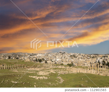 Roman ruins (against the background of a beautiful sky with clouds) in the Jordanian city of Jerash (Gerasa of Antiquity), capital and largest city of Jerash Governorate, Jordan Roman ruins (against the background of a beautiful sky with clouds) in the Jordanian city of Jerash (Gerasa of Antiquity), capital and largest city of Jerash Governorate, Jordan 112901565