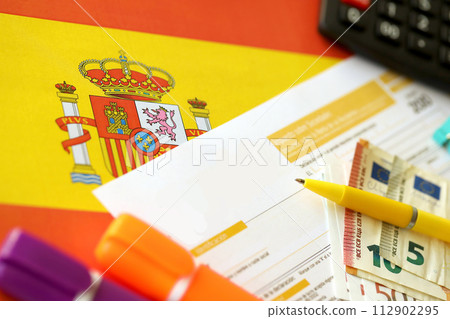 Modelo 200 spanish tax form for corporate income tax for non resident taxpayer lies on flag of Spain close up on accountant table 112902295