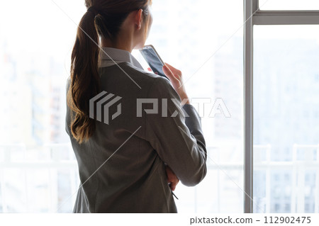 Portrait of a woman working from home Portrait of a woman working from home 112902475