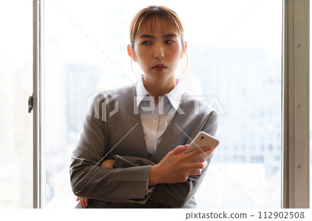 Portrait of a woman working from home Portrait of a woman working from home 112902508