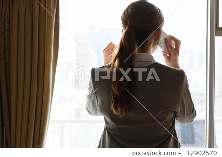Portrait of a woman working from home Portrait of a woman working from home 112902570