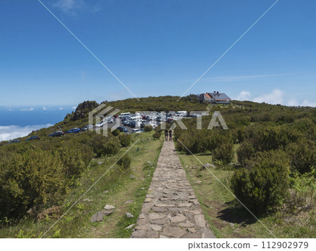 Full parking lot, car park of the Achada do Teixeira, an altitude restaurant at the start of the hiking trail PR1.2 from to Pico Ruivo mountain, the highest peak in the Madeira, Portugal 112902979