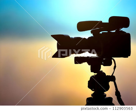 Silhouette of a professional studio video camera. Preparation and release of news. 112903563