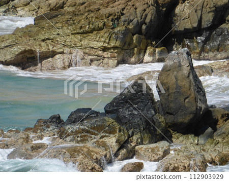Obelisk shaped rocks along St. Maarten coast 112903929