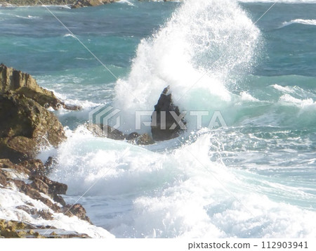 Waves crash onto rocky coastline Waves crash onto rocky coastline 112903941