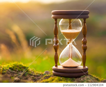 Hourglass on Moss Covered Ground. Generative AI 112904104