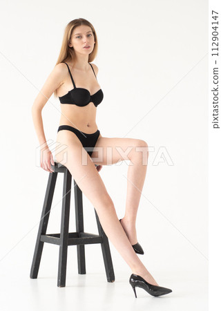 Studio model test, snap, polaroid. Beautiful young european woman on white background 112904147