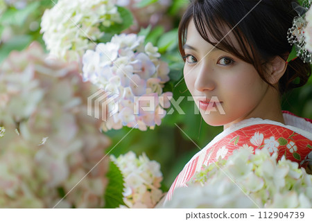 Hydrangea and young woman 112904739