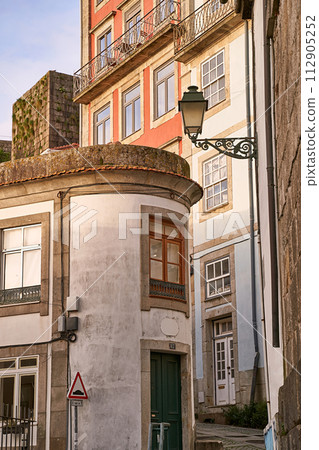 Porto, Portugal. Picturesque steep narrow street in the old town. 112905252
