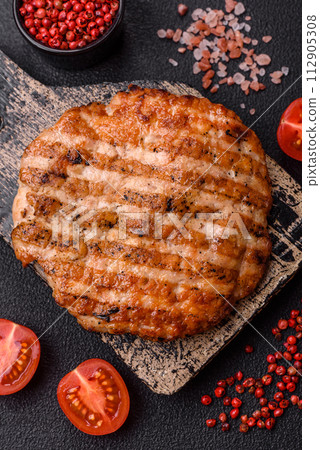 Delicious fresh grilled chicken fillet with spices and herbs Delicious fresh grilled chicken fillet with spices and herbs 112905308
