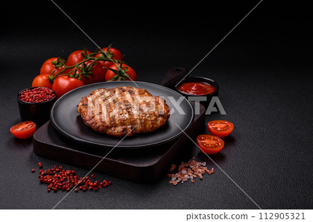 Delicious fresh grilled chicken fillet with spices and herbs 112905321