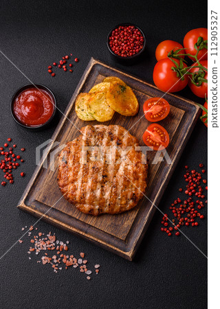 Delicious fresh grilled chicken fillet with spices and herbs Delicious fresh grilled chicken fillet with spices and herbs 112905327